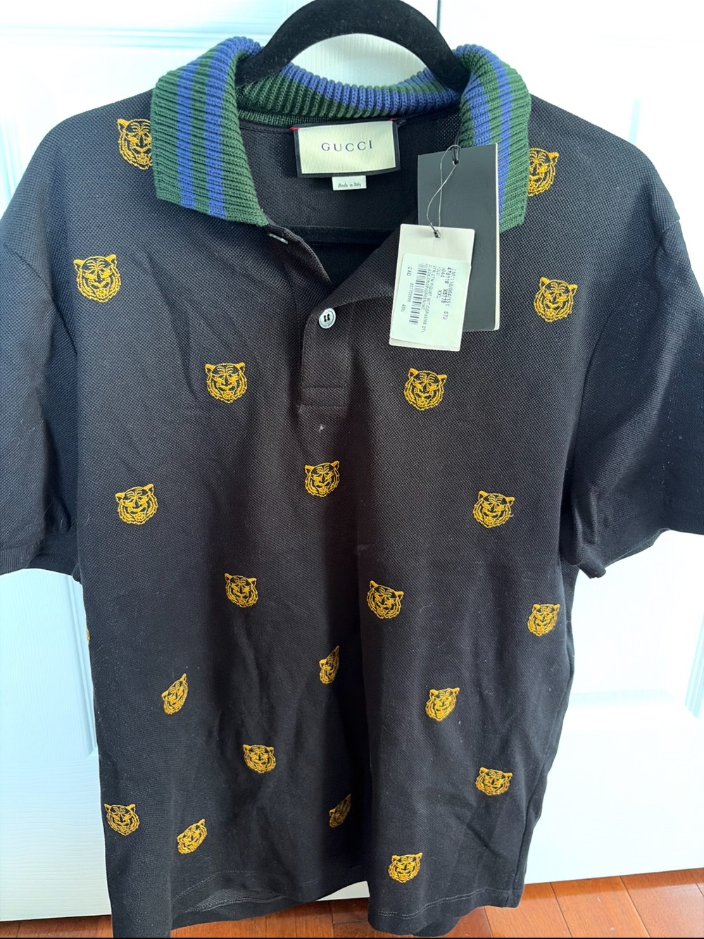 Gucci Black Polo with Yellow Tiger Motifs and Green-Blue Striped Collar
